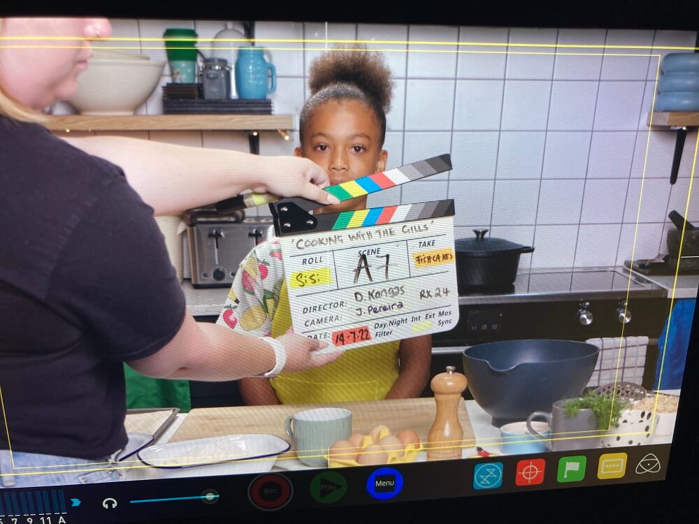 Clapper board with child cooking